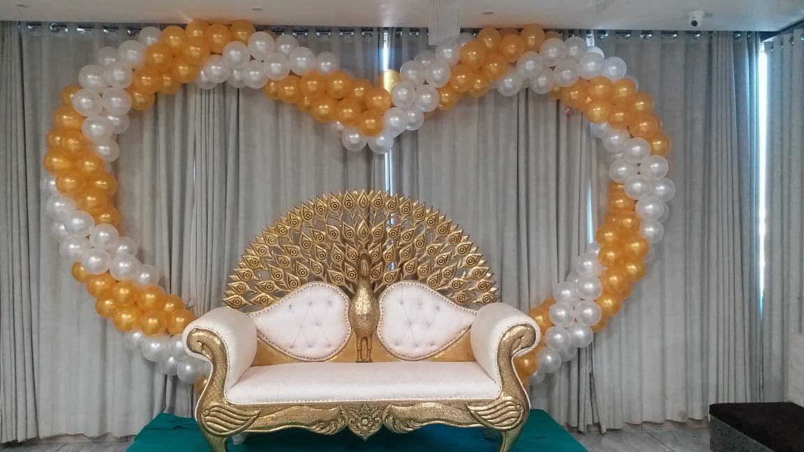 Grand wedding entry decoration by Balloons Decorations Anand And All Events for bride and groom entrance with balloons and elegant setup in Anand Gujarat